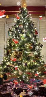 Brightly lit Christmas tree with gifts and festive decorations.