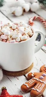 Cup of hot cocoa with marshmallows and gingerbread cookie on Christmas table.