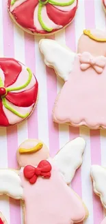 Colorful festive cookies with angel and swirl designs on a pink striped background.