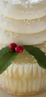 Festive cupcake with creamy frosting and holiday decor.