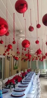 Red Christmas ornaments hanging elegantly indoors for festive decor.