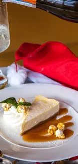 Festive dessert with cheesecake and champagne on a holiday-themed table.