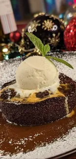 A festive dessert with chocolate cake and ice cream on a decorated table.