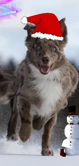 Dog in Santa hat runs beside snowman on snowy day.