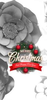 Grayscale Christmas wreath with red accents on floral background.