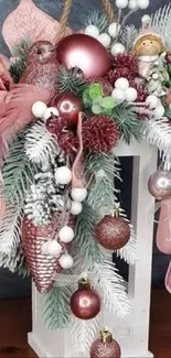 Festive floral holiday decor with pink and white accents on a dark gray background.