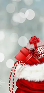 Festive red gift sack with snowy background.