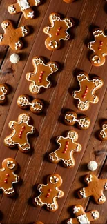 Festive gingerbread cookies on wooden background.