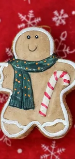 Playful gingerbread man with candy cane on red snowflake background.