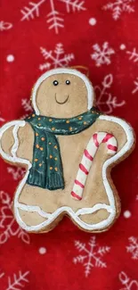 Gingerbread man on red snowflake background for mobile wallpaper.
