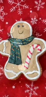 Gingerbread man with scarf on red snowflake background.