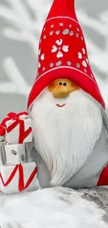 Festive gnome with gifts in snow; red hat and white beard; winter holiday theme.