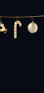 Gold holiday ornaments on black wallpaper.