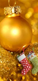 Gold Christmas ornament mobile wallpaper with festive stockings.