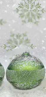 Green Christmas ornament with snowflakes in winter design.