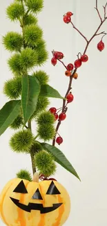 Carved pumpkin with greenery and red berries for Halloween decor.