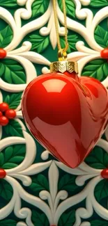 Red heart ornament on decorative green background.