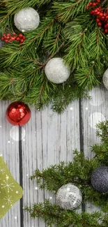 Festive holiday wallpaper with pine branches and ornaments.