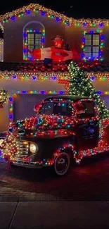 House and truck adorned in colorful holiday lights at night.