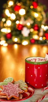 Festive red mug with cookies and Christmas tree.