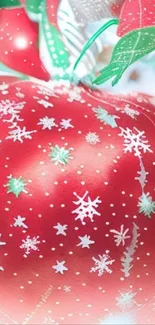 Red ornament with snowflake patterns on a mobile wallpaper.