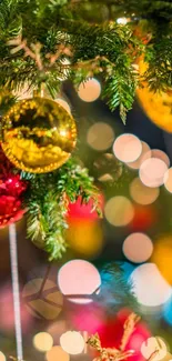 Christmas tree branches with festive ornaments and bokeh lights.