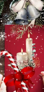 Festive holiday phone wallpaper with candles, candy cane, and Christmas decor.