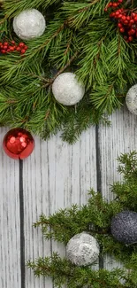 Festive holiday wallpaper with pine branches, red berries, and ornaments.