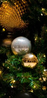 Festive Christmas tree with golden ornaments and green branches, illuminated by lights.