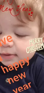 Close-up of child with holiday greetings and festive wishes on wallpaper.