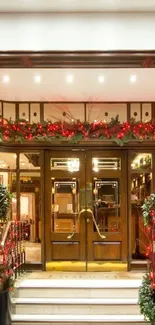 Festive hotel entrance with red lights and greenery decor.