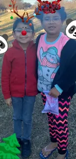 Children in festive attire with holiday decorations and emojis.