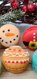 Festive macarons with holiday designs on display.