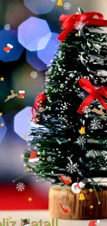 Mini Christmas tree with red ribbons on table and blue bokeh lights.