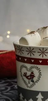 Festive mug with marshmallows and red holiday sweater background.