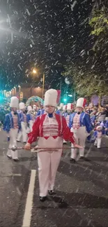 A vibrant night parade with marching bands under snowy skies.