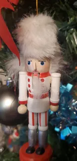 Nutcracker ornament on a Christmas tree.