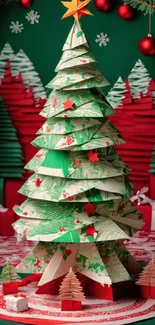 Festive origami Christmas tree with gifts in green and red holiday theme.