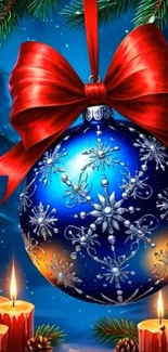 Christmas ornament with red bow and candles