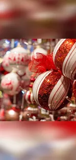 Close-up of red and white ornaments in festive holiday setting.