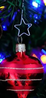 Red Christmas ornament with colorful lights.