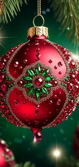 Red and green sparkling Christmas ornament on a festive background.