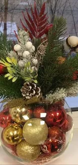 Festive vase with colorful ornaments by a window.