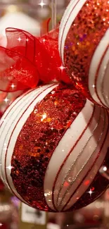 Red and white holiday ornaments glittering on a festive Christmas display.