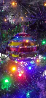 Colorful glass ornament on Christmas tree.