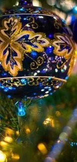 Blue and gold Christmas ornament with festive lights.