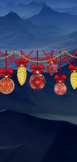 Festive red and gold Christmas ornaments with blue mountain background.