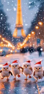 Owls in Santa hats on a snowy Paris street with lights.