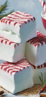 Stacked peppermint marshmallows with festive decor.