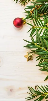 Phone wallpaper with festive pine branches and ornaments.